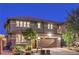 Two-story home with a well-manicured front yard and a two-car garage, captured at dusk at 10243 Aragon Crown Rd, Las Vegas, NV 89135