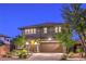 Attractive two-story home with stone accents and a well-manicured front yard at 10243 Aragon Crown Rd, Las Vegas, NV 89135