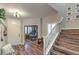 Welcoming foyer with hardwood floors, staircase, and an adjacent office space at 10243 Aragon Crown Rd, Las Vegas, NV 89135