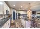 Modern kitchen features stainless steel appliances, granite countertops, stylish backsplash, and a large kitchen island at 10243 Aragon Crown Rd, Las Vegas, NV 89135