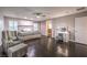 This large main bedroom boasts a sitting area, vanity, ensuite bath, and ceiling fan at 10243 Aragon Crown Rd, Las Vegas, NV 89135