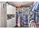Well-organized walk-in closet with shelves, drawers, and racks for clothing and accessories at 10243 Aragon Crown Rd, Las Vegas, NV 89135