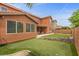 The backyard has an artificial grass lawn and a putting green at 10300 S Dapple Gray Rd, Las Vegas, NV 89178