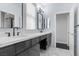 Modern bathroom featuring double sinks, sleek black fixtures, and a bright, airy ambiance at 10300 S Dapple Gray Rd, Las Vegas, NV 89178