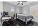 Comfortable bedroom with a desk, ceiling fan, and natural light from the window at 10300 S Dapple Gray Rd, Las Vegas, NV 89178