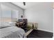 Cozy bedroom setup with a desk area and a comfortable bed at 10300 S Dapple Gray Rd, Las Vegas, NV 89178