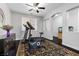 Exercise room with equipment and an area rug, bathed in natural light at 10300 S Dapple Gray Rd, Las Vegas, NV 89178