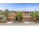 Charming two-story home with well-manicured landscaping and a welcoming front entrance at 10300 S Dapple Gray Rd, Las Vegas, NV 89178