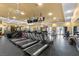 A well-equipped gym featuring rows of treadmills, stationary bikes, and weight machines for a complete workout experience at 10300 S Dapple Gray Rd, Las Vegas, NV 89178