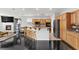 Spacious kitchen with a large island, wood cabinets, and modern appliances at 10300 S Dapple Gray Rd, Las Vegas, NV 89178