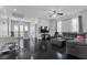 Upstairs living area with lots of natural light, hardwood floors, and comfortable seating at 10300 S Dapple Gray Rd, Las Vegas, NV 89178