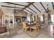 Inviting resident lounge featuring a stone fireplace, beamed ceilings, and elegant seating for relaxation and social gatherings at 10300 S Dapple Gray Rd, Las Vegas, NV 89178