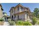 Stylish two-story house features low-maintenance landscaping, a stone facade, and a welcoming walkway at 10360 Pescado Ln, Las Vegas, NV 89135