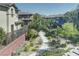 A beautifully landscaped walkway is seen through the townhome complex at 10360 Pescado Ln, Las Vegas, NV 89135