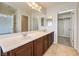 This bathroom offers a double sink vanity and a walk in closet at 1064 Calvia St, Las Vegas, NV 89138