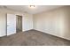This bedroom offers neutral paint, carpet, and a ceiling light at 1064 Calvia St, Las Vegas, NV 89138