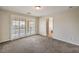 Bedroom featuring carpet and balcony access, with an ensuite bathroom at 1064 Calvia St, Las Vegas, NV 89138