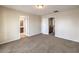 This bedroom offers neutral paint, carpet, and multiple doors at 1064 Calvia St, Las Vegas, NV 89138
