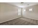 This bedroom offers neutral paint, carpet, and plantation shutters at 1064 Calvia St, Las Vegas, NV 89138