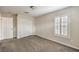 This bedroom offers neutral paint, carpet, plantation shutters, and closet space at 1064 Calvia St, Las Vegas, NV 89138