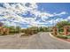 Inviting community entrance with stone signage and landscaped surroundings, creating a welcoming feel at 1064 Calvia St, Las Vegas, NV 89138