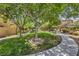 Scenic community park with mature trees, manicured lawn, and walking path, perfect for outdoor activities at 1064 Calvia St, Las Vegas, NV 89138