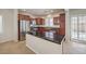 Open kitchen with stainless steel appliances, granite countertops, and an island with lots of storage at 1064 Calvia St, Las Vegas, NV 89138