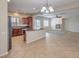 Open-concept kitchen with granite countertops, stainless steel appliances, and view of the living room at 1064 Calvia St, Las Vegas, NV 89138