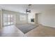 Bright living room featuring tile floors, a fireplace, ceiling fan, and sliding glass doors to the patio at 1064 Calvia St, Las Vegas, NV 89138
