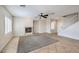 Spacious living room with tile floors, fireplace, ceiling fan, and windows with plantation shutters at 1064 Calvia St, Las Vegas, NV 89138