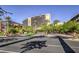 Red Rock Casino entrance with palm trees, lush landscaping, and street view at 1064 Calvia St, Las Vegas, NV 89138