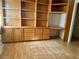 Bright room boasts practical laminate flooring and a built-in shelving system with storage for personalized organization at 1409 Santa Margarita St # B, Las Vegas, NV 89146