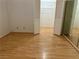Bedroom with blonde wood floors, closet with bifold doors and white walls at 1409 Santa Margarita St # B, Las Vegas, NV 89146