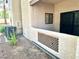 Exterior shot of building with air conditioning units, stucco wall and shrubbery at 1409 Santa Margarita St # B, Las Vegas, NV 89146