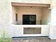 Covered patio with stucco walls, and wrought iron security door at 1409 Santa Margarita St # B, Las Vegas, NV 89146