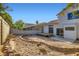 Expansive backyard with a wooden deck and block wall providing privacy at 1547 Balsam Mist Ave, Las Vegas, NV 89183
