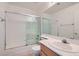 Bathroom featuring a tiled shower, vanity, sink, and commode at 1547 Balsam Mist Ave, Las Vegas, NV 89183