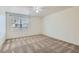 Sunny bedroom with plush carpet and a view of the neighborhood at 1547 Balsam Mist Ave, Las Vegas, NV 89183