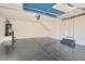 Spacious garage with epoxy flooring, ample storage, and convenient access for parking and projects at 1547 Balsam Mist Ave, Las Vegas, NV 89183