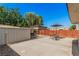 Spacious backyard featuring a shed, table, chairs, patio and a nice wooden fence at 1832 Merze Ave, Henderson, NV 89011
