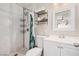 Bathroom featuring a tiled shower, toilet, vanity, and decorative shower curtain at 1832 Merze Ave, Henderson, NV 89011