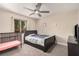 Bedroom with carpet flooring, standard-sized bed, and a black framed window at 1832 Merze Ave, Henderson, NV 89011