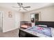 Bedroom with carpet flooring, standard-sized bed, and a black framed window at 1832 Merze Ave, Henderson, NV 89011