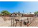 Charming single-story home with fenced yard, offering a blend of security and curb appeal under a clear blue sky at 1832 Merze Ave, Henderson, NV 89011