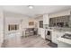 Modern kitchen boasting white cabinetry, stainless steel appliances, and an open layout perfect for cooking and entertaining at 1832 Merze Ave, Henderson, NV 89011