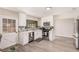 Bright and modern kitchen featuring stainless steel appliances, white cabinets and plenty of counter space, perfect for cooking at 1832 Merze Ave, Henderson, NV 89011