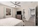 Main bedroom featuring a flatscreen TV, ensuite bathroom, and hallway access at 1832 Merze Ave, Henderson, NV 89011