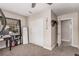 Office/bedroom with carpet flooring, storage closet, and office desk at 1832 Merze Ave, Henderson, NV 89011