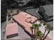 Bird's-eye view showcasing the home's terracotta tile roof and mature palm trees at 2102 Rhonda Ter, Henderson, NV 89074