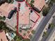 Aerial view showcasing the property's layout, landscaping, and proximity to nearby street at 2102 Rhonda Ter, Henderson, NV 89074